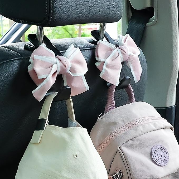 Amooca Car Seat Headrest Hook Cute Bowknot Vehicle Hanger Car Storage Organizer for Handbag Purse Coat Grocery Bag Black Pink