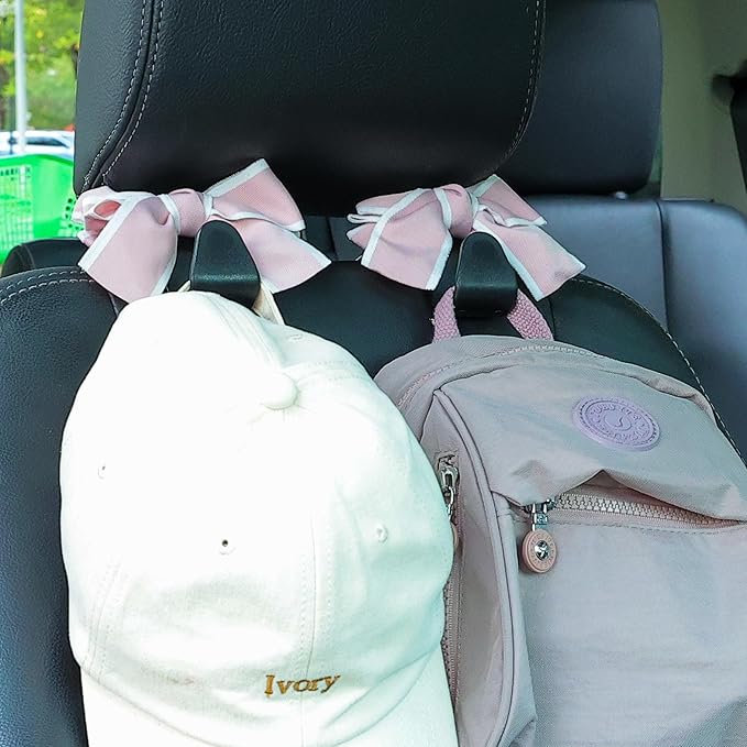Amooca Car Seat Headrest Hook Cute Bowknot Vehicle Hanger Car Storage Organizer for Handbag Purse Coat Grocery Bag Black Pink